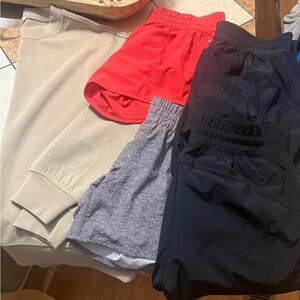 Lululemon Athletica sweatshirt, 4 pair shorts -  Red, Gray, and Black and Camo